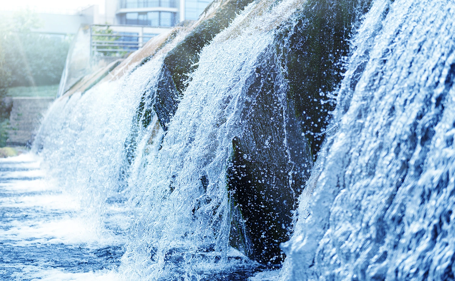 a waterfall in a clean treated river