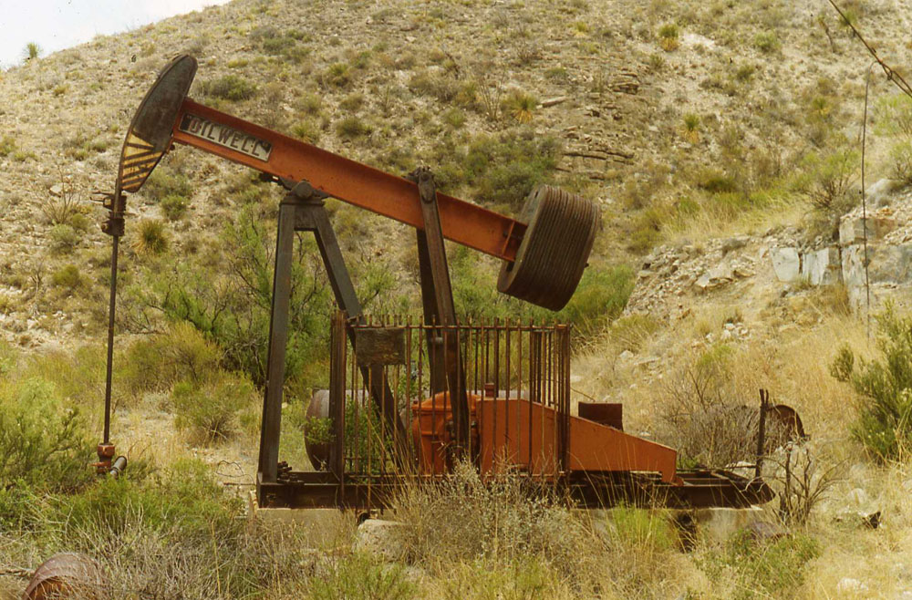 Treated water reused for fracturing and waterflooding